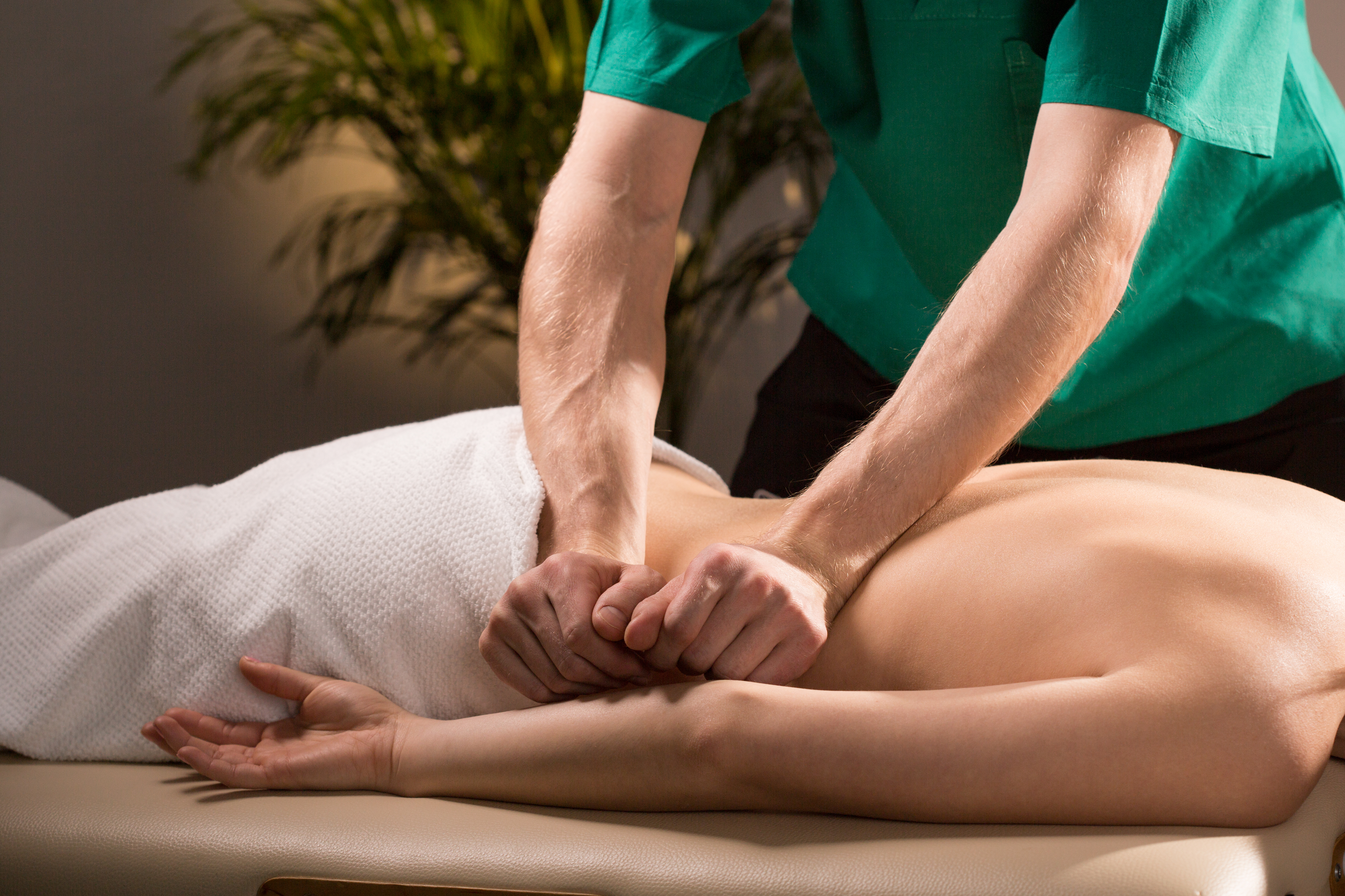 Close-up of physical therapist doing medical massage-1