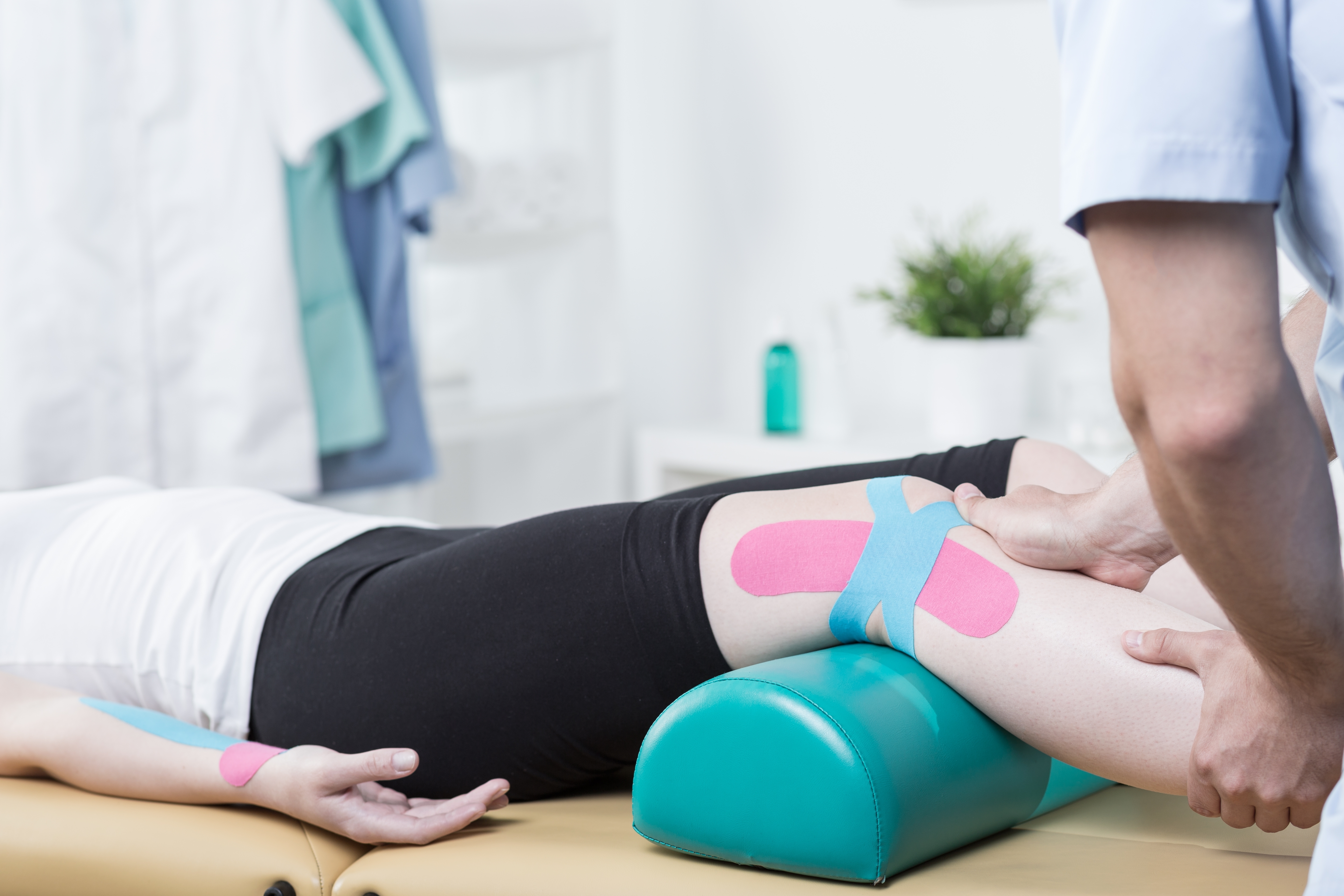 Photo of patient with elastic therapeutic tape during exercises-1