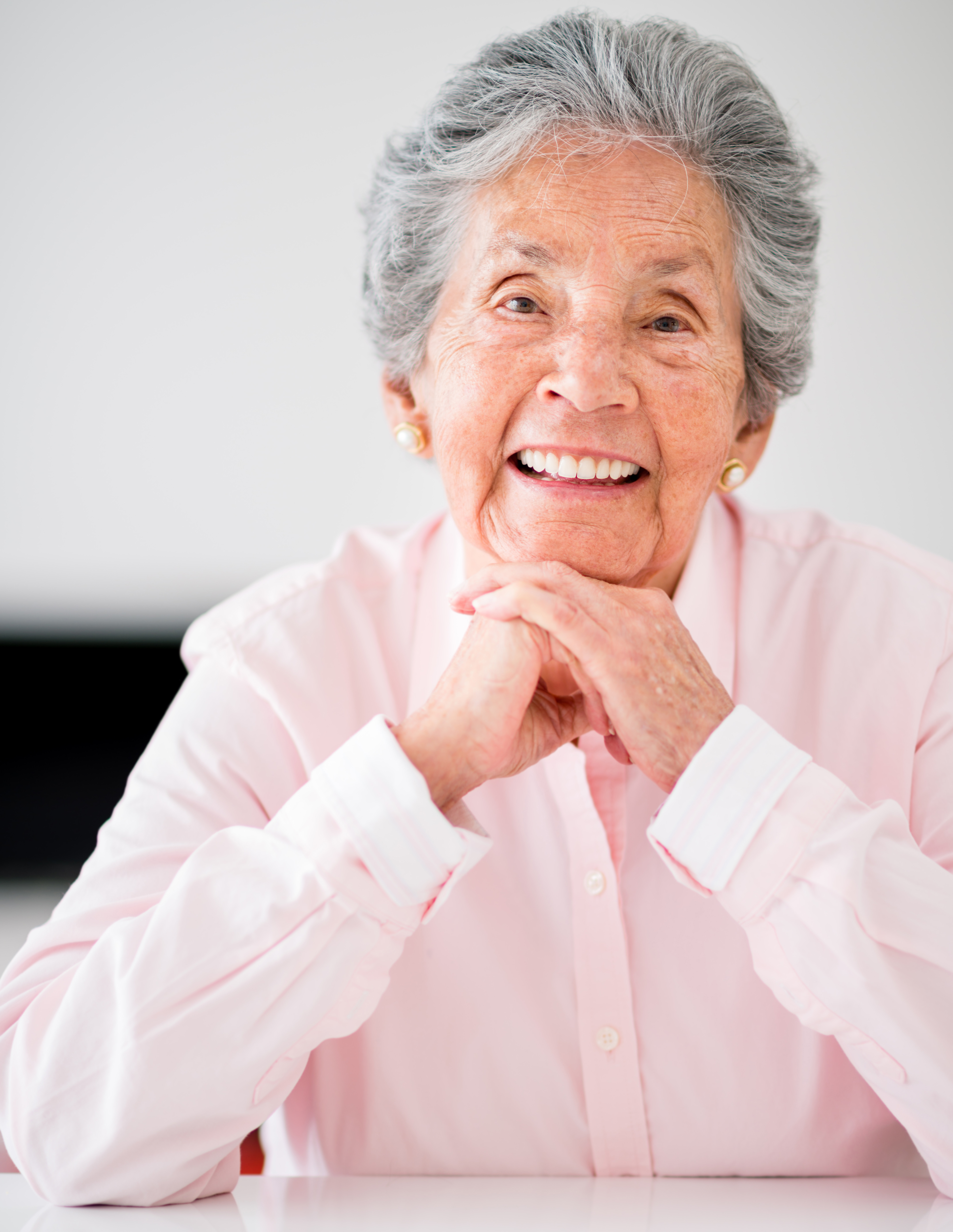 Portrait of a beautiful senior woman smiling at home